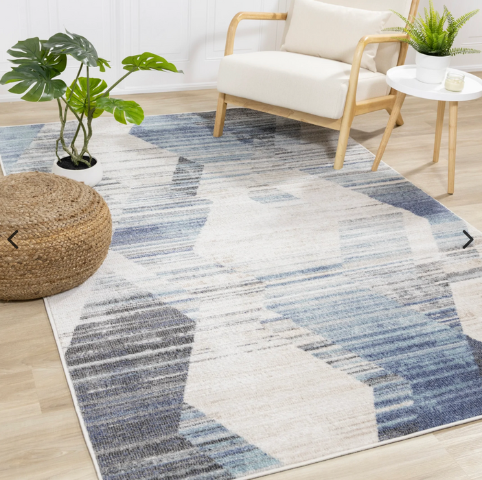 Fresco Area Rug - blue tones - in living room setting