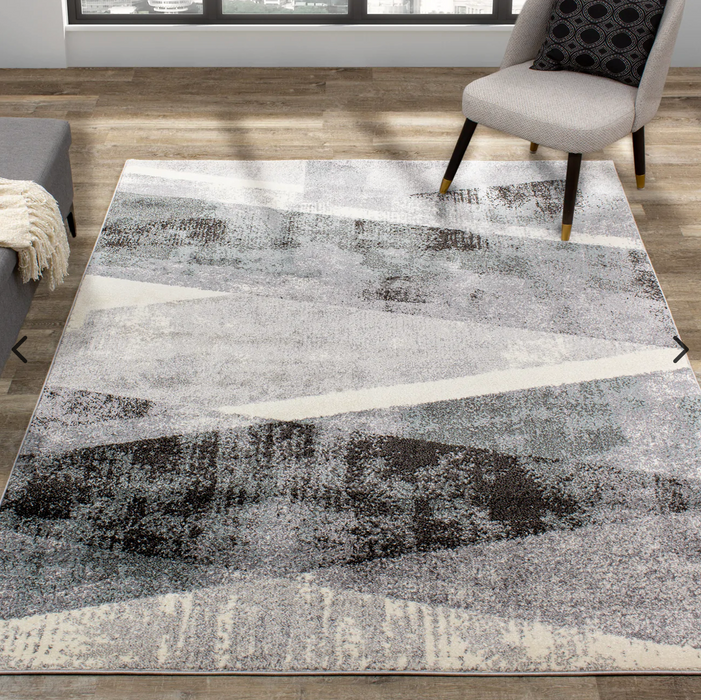 Geometric patterned Soho area rug with grey, black and creamy white tones