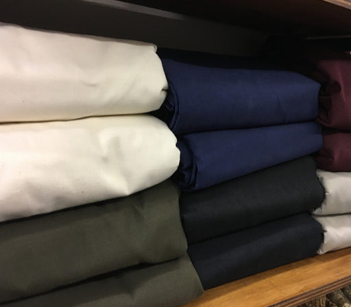 Image of stacked Twill Futon Covers in various colours
