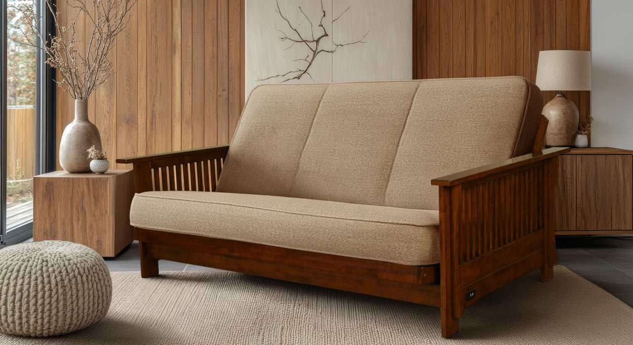 Beige sofa with wooden frame in a room with wooden walls and decor.