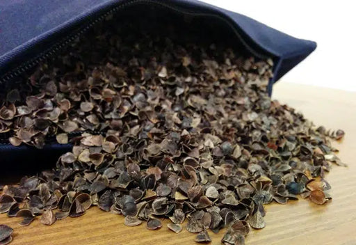 buckwheat coming out of pillow onto table