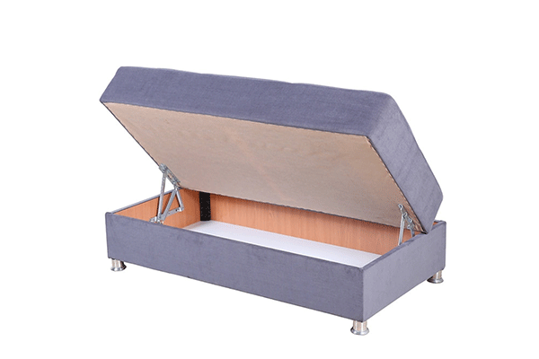 Soft grey matching ottoman - tilted open to showcase storage