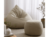 Teardrop shaped bean bag lounger with ottoman in living room setting